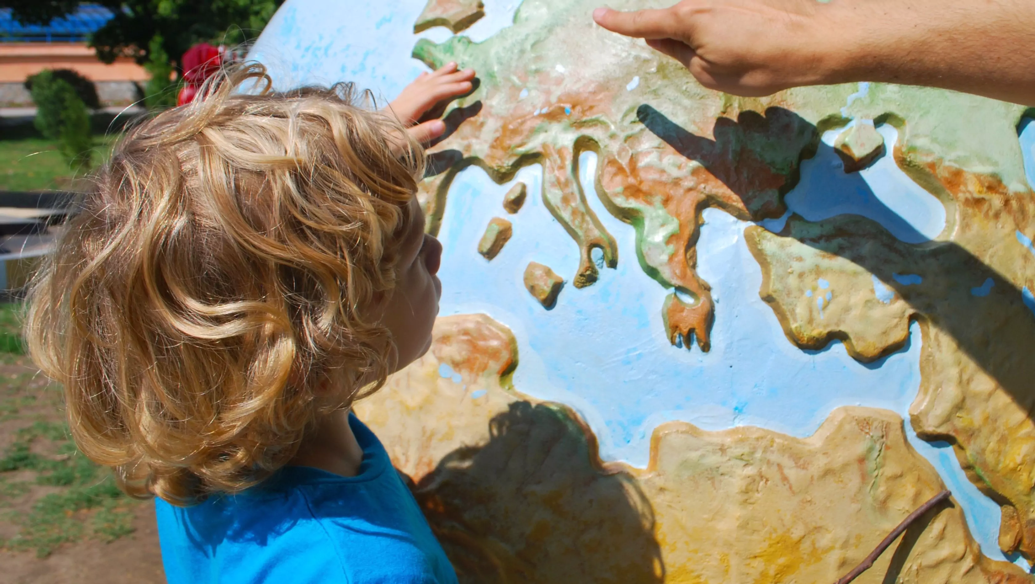 boy learning about the globe